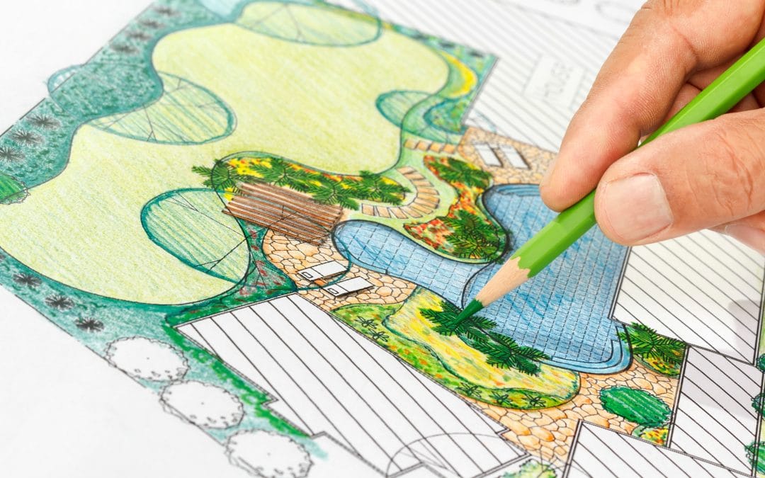 Hardscaping Ideas Hand sketching a colorful landscape design with a green pencil, detailing a garden and pool area.